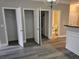 Open living space showcasing new flooring, white trim, and view of a bathroom at 2612 Halligan Pointe, Riverdale, GA 30296