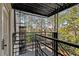 Private balcony featuring a metal railing and a view of mature trees at 30 Collier Nw Rd # 6, Atlanta, GA 30309