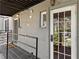 Apartment entryway featuring painted brick, diamond plate flooring and decorative iron railings at 30 Collier Nw Rd # 6, Atlanta, GA 30309