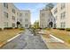 Apartment complex exterior view featuring manicured lawns and trimmed shrubbery at 30 Collier Nw Rd # 6, Atlanta, GA 30309