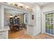 Well-lit kitchen with white cabinets, brick flooring, open to the dining room at 30 Collier Nw Rd # 6, Atlanta, GA 30309