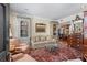 Inviting living room with bookshelves, a plush sofa, area rug and elegant furnishings at 30 Collier Nw Rd # 6, Atlanta, GA 30309