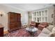 Cozy living room with antique furniture, area rug, and ample seating at 30 Collier Nw Rd # 6, Atlanta, GA 30309