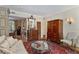 Elegant living room with antique furniture, area rug, and views into the dining room at 30 Collier Nw Rd # 6, Atlanta, GA 30309
