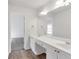 Bathroom view showing a white double sink vanity with drawers and a large mirror at 360 Wembley Cir, Atlanta, GA 30328