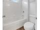 Spotless, all-white bathroom with tub/shower combo and modern fixtures at 360 Wembley Cir, Atlanta, GA 30328