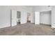 Spacious bedroom with neutral carpeting, walk-in closet, and ensuite bathroom at 360 Wembley Cir, Atlanta, GA 30328