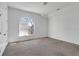 A bright bedroom with a large arched window with plenty of natural light at 360 Wembley Cir, Atlanta, GA 30328