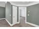 Bedroom with gray walls, white crown molding, and a view into the next room at 360 Wembley Cir, Atlanta, GA 30328