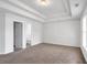 A bright bedroom with attached bath with tray ceilings and neutral color palettes at 360 Wembley Cir, Atlanta, GA 30328