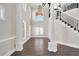 Stunning foyer boasts soaring ceilings, grand staircase and tons of natural light at 360 Wembley Cir, Atlanta, GA 30328
