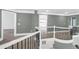 Upstairs hallway with gray walls, white crown molding, and black metal railing at 360 Wembley Cir, Atlanta, GA 30328