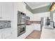 Contemporary kitchen with stainless steel appliances and marble countertops at 360 Wembley Cir, Atlanta, GA 30328