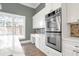 Well-appointed kitchen boasts stainless steel appliances and white cabinets at 360 Wembley Cir, Atlanta, GA 30328