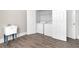 Bright laundry room featuring a modern washer, dryer, and wash basin at 360 Wembley Cir, Atlanta, GA 30328