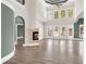 Open living room featuring a fireplace, hardwood floors, and lots of natural light at 360 Wembley Cir, Atlanta, GA 30328