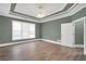Spacious main bedroom features a trey ceiling, large windows and beautiful flooring at 360 Wembley Cir, Atlanta, GA 30328