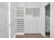 A clean, well-organized walk-in closet with custom shelving and drawers at 360 Wembley Cir, Atlanta, GA 30328