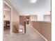 A naturally lit, neutral colored hallway with carpeted floors at 506 Pleasant View Ct, Woodstock, GA 30188