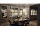 Outdoor patio with wicker seating, glass-top table, and views of the home's interior through large windows at 2903 Eva Clb, Acworth, GA 30101