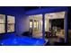 Inviting outdoor living space with hot tub, dining area, ceiling fan, and built in grill at 2903 Eva Clb, Acworth, GA 30101