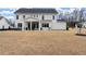Expansive backyard features a hot tub and covered patio for outdoor enjoyment at 2903 Eva Clb, Acworth, GA 30101