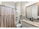 Well-lit bathroom with granite countertops and a shower-tub combo, designed for comfort and style at 2903 Eva Clb, Acworth, GA 30101