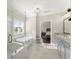 Bright bathroom with tub and separate shower featuring gray cabinets and stone countertops at 2903 Eva Clb, Acworth, GA 30101