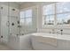 Well lit bathroom featuring soaking tub next to a frameless glass shower at 2903 Eva Clb, Acworth, GA 30101