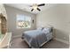 Comfortable bedroom with a large window, neutral tones, and plush carpeting at 2903 Eva Clb, Acworth, GA 30101