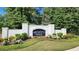 Elegant brick community sign with lush landscaping, welcoming residents and visitors at 2903 Eva Clb, Acworth, GA 30101