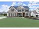 Attractive two-story brick home with shutters, stone entryway, and well-kept landscaping at 2903 Eva Clb, Acworth, GA 30101