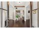 Bright foyer with dark wood floors, natural lighting, and decorative wood beam feature on ceiling at 2903 Eva Clb, Acworth, GA 30101