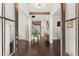 Elegant foyer with hardwood floors, wood beam, and stairway to upper level at 2903 Eva Clb, Acworth, GA 30101