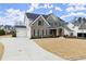 Brick front exterior with manicured lawn offers a charming and inviting curb appeal at 2903 Eva Clb, Acworth, GA 30101