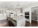 Gourmet kitchen boasts granite island, stainless appliances, double oven and a walk-in pantry at 2903 Eva Clb, Acworth, GA 30101