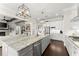 Spacious eat-in kitchen with large center island, stainless appliances, and modern lighting at 2903 Eva Clb, Acworth, GA 30101