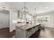 Stylish kitchen with granite island, stainless appliances, white cabinets and eat in area at 2903 Eva Clb, Acworth, GA 30101