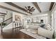 Open-concept living space flows into a modern kitchen with an expansive island and stainless appliances at 2903 Eva Clb, Acworth, GA 30101