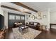 Cozy living room with dark accent wall, exposed beams, and a stylish seating arrangement at 2903 Eva Clb, Acworth, GA 30101