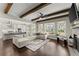 Spacious living room with hardwood floors, fireplace, and beamed ceiling at 2903 Eva Clb, Acworth, GA 30101
