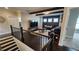 Upstairs landing featuring a cozy living room with exposed beams and comfortable seating at 2903 Eva Clb, Acworth, GA 30101