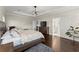Spacious main bedroom with hardwood floors, tray ceilings, and access to the Primary bath at 2903 Eva Clb, Acworth, GA 30101