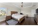 Spacious main bedroom with tray ceiling, hardwood floors, and ample natural light at 2903 Eva Clb, Acworth, GA 30101