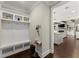 Convenient mudroom with built-in bench and storage, seamlessly connecting to the main living area at 2903 Eva Clb, Acworth, GA 30101