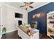 Inviting home office featuring a large desk, custom wall, and plenty of shelving at 2903 Eva Clb, Acworth, GA 30101