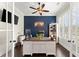 Stylish home office with custom built-ins, hardwood floors, and ample natural light at 2903 Eva Clb, Acworth, GA 30101