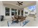 Covered patio with outdoor kitchen and dining area for enjoying al fresco meals at 2903 Eva Clb, Acworth, GA 30101