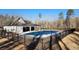 Community pool with covered patio area surrounded by a black metal fence at 2903 Eva Clb, Acworth, GA 30101