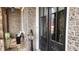 Charming front porch with double doors, comfortable seating, and attractive landscaping at 2903 Eva Clb, Acworth, GA 30101